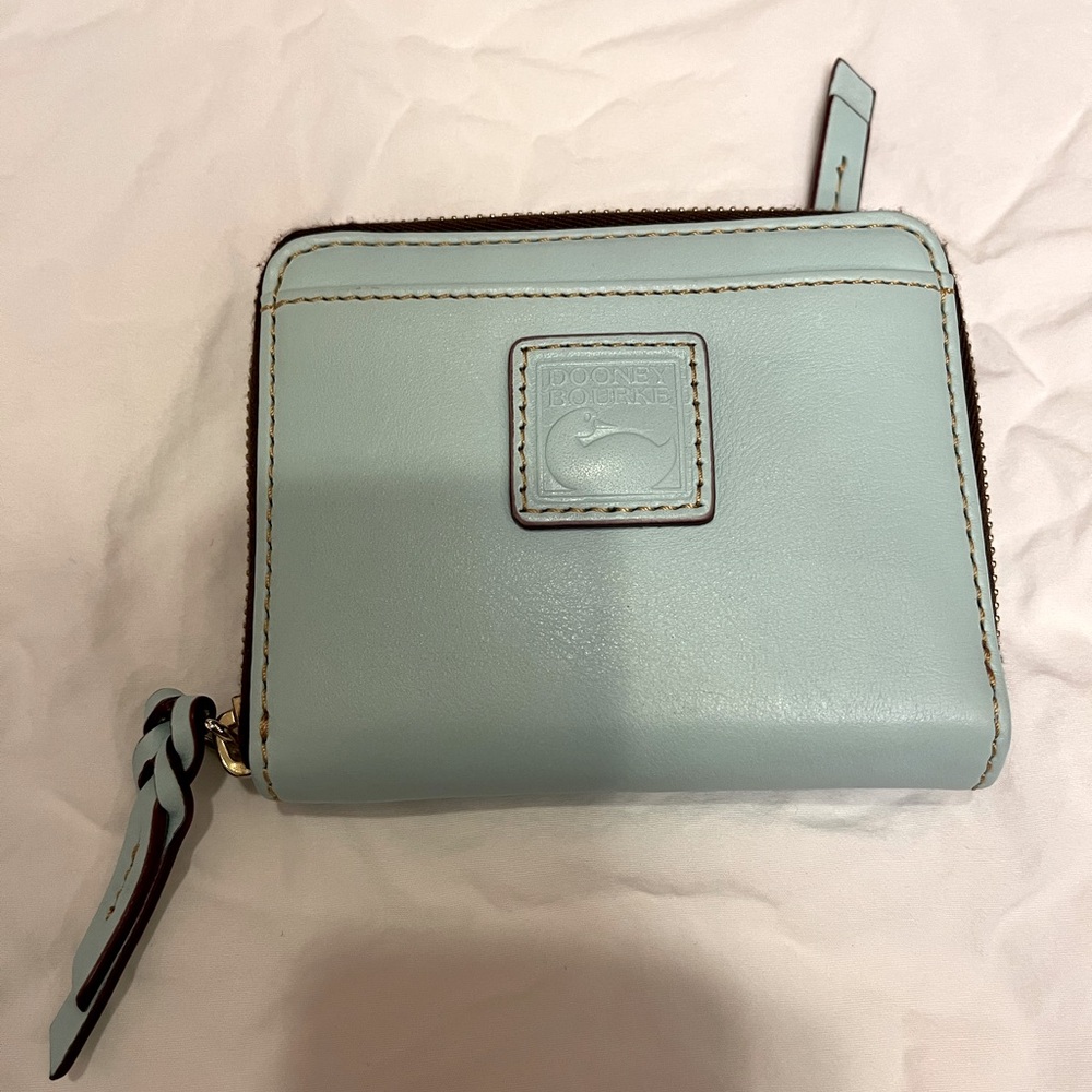 Dooney & Bourke Florentine medium zip wallet in the color, pale blue.